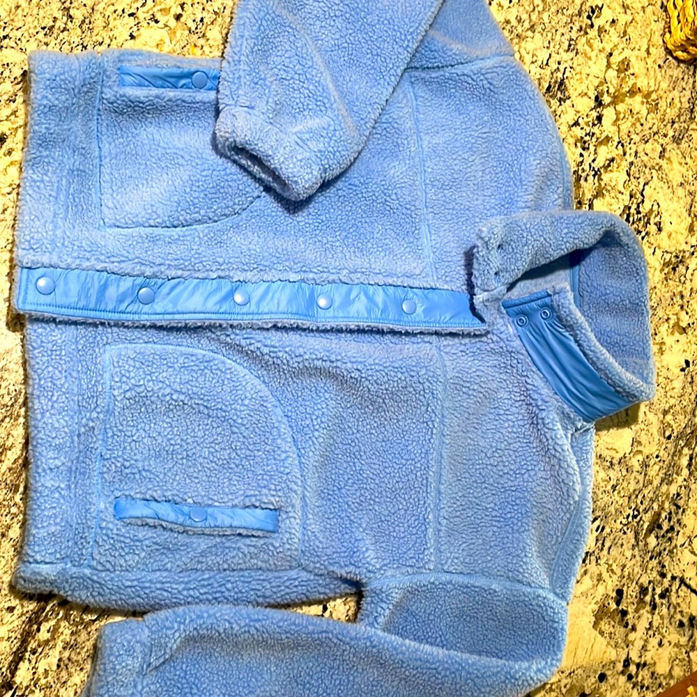 Beautiful blue Sherpa jacket. Button snaps. Like new. Short style.